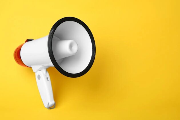 Electronic megaphone on color background Electronic megaphone on color background